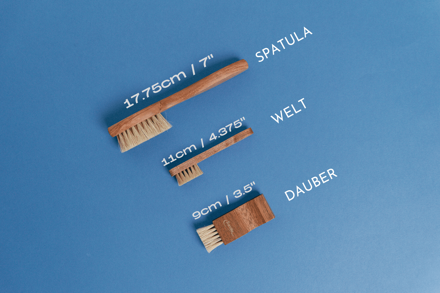 Saphir Medaille d'Or Wood Spatula Horse Hair Shoe Brush displayed with saphir medaille d'or mini spatula / welt brush and saphir medaille d'or dauber applicator brush - Brillare
