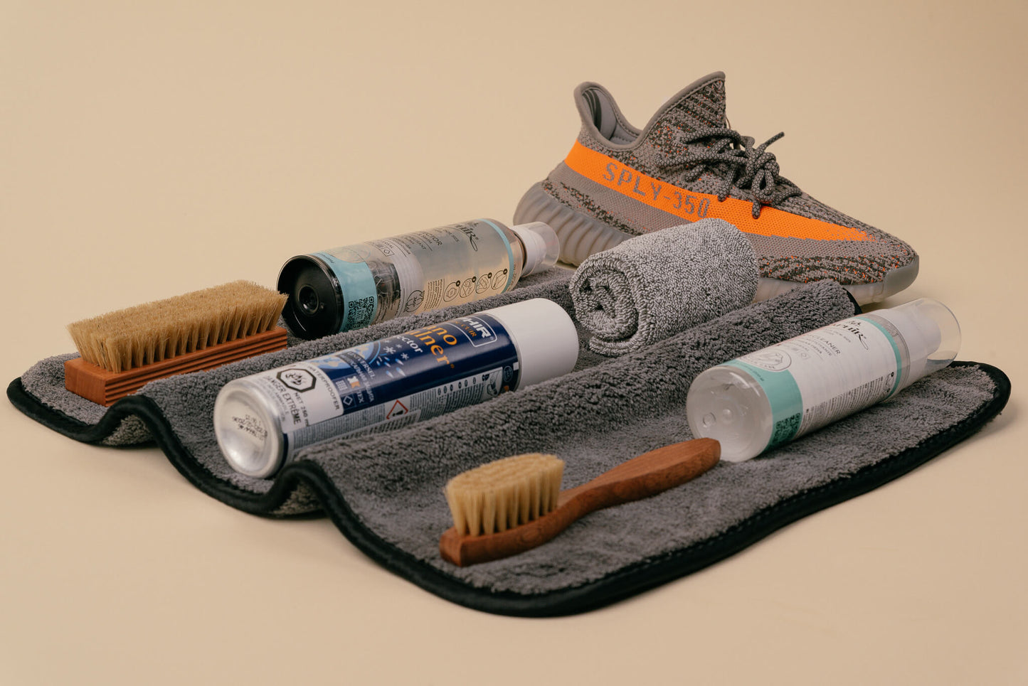Brillaré Premium sneaker car kit. Feating Saphir Medaille d'or Horse hair spatula brush, horsehair shine brush, foam cleaner, & protectant spray. Saphir BDC Nano Invulner spray, jumbo brillare cleaning mat and brillare deluxe microfibre cloth shown with Yeezy 350