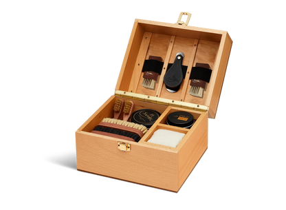 For the leather connoisseur. Presented in a stunning Beechwood box. A wonderful gift or addition to the shoe arsenal. Solid beech frame made in France, with a natural finish and vegetal leather trims.    The Groom Deluxe Box contains the following:  2 x 100ml shoe polish tin (1 x black, 1 x dark brown) 1 x renovator cream 2 x Spatula brushes 2 x Shoe polisher brushes 2 x Small spreaders 1 x Polish cloth  &nbsp;Size: 37X20X15cm