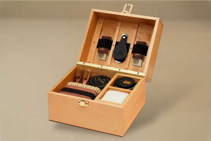 For the leather connoisseur. Presented in a stunning Beechwood box. A wonderful gift or addition to the shoe arsenal. Solid beech frame made in France, with a natural finish and vegetal leather trims.    The Groom Deluxe Box contains the following:  2 x 100ml shoe polish tin (1 x black, 1 x dark brown) 1 x renovator cream 2 x Spatula brushes 2 x Shoe polisher brushes 2 x Small spreaders 1 x Polish cloth  &nbsp;Size: 37X20X15cm