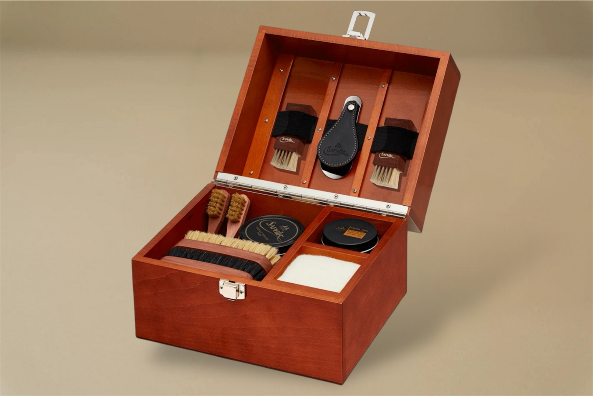 For the leather connoisseur. Presented in a stunning Beechwood box. A wonderful gift or addition to the shoe arsenal. Solid beech frame made in France, with a natural finish and vegetal leather trims.    The Groom Deluxe Box contains the following:  2 x 100ml shoe polish tin (1 x black, 1 x dark brown) 1 x renovator cream 2 x Spatula brushes 2 x Shoe polisher brushes 2 x Small spreaders 1 x Polish cloth  &nbsp;Size: 37X20X15cm