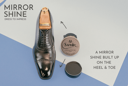 Brillaré mirror shine service photo - Black TOM FORD cap toe leather oxford shoes shown with Saphir Medaille d'or Mirror gloss and Saphir Pate De Luxe paste wax polish as display