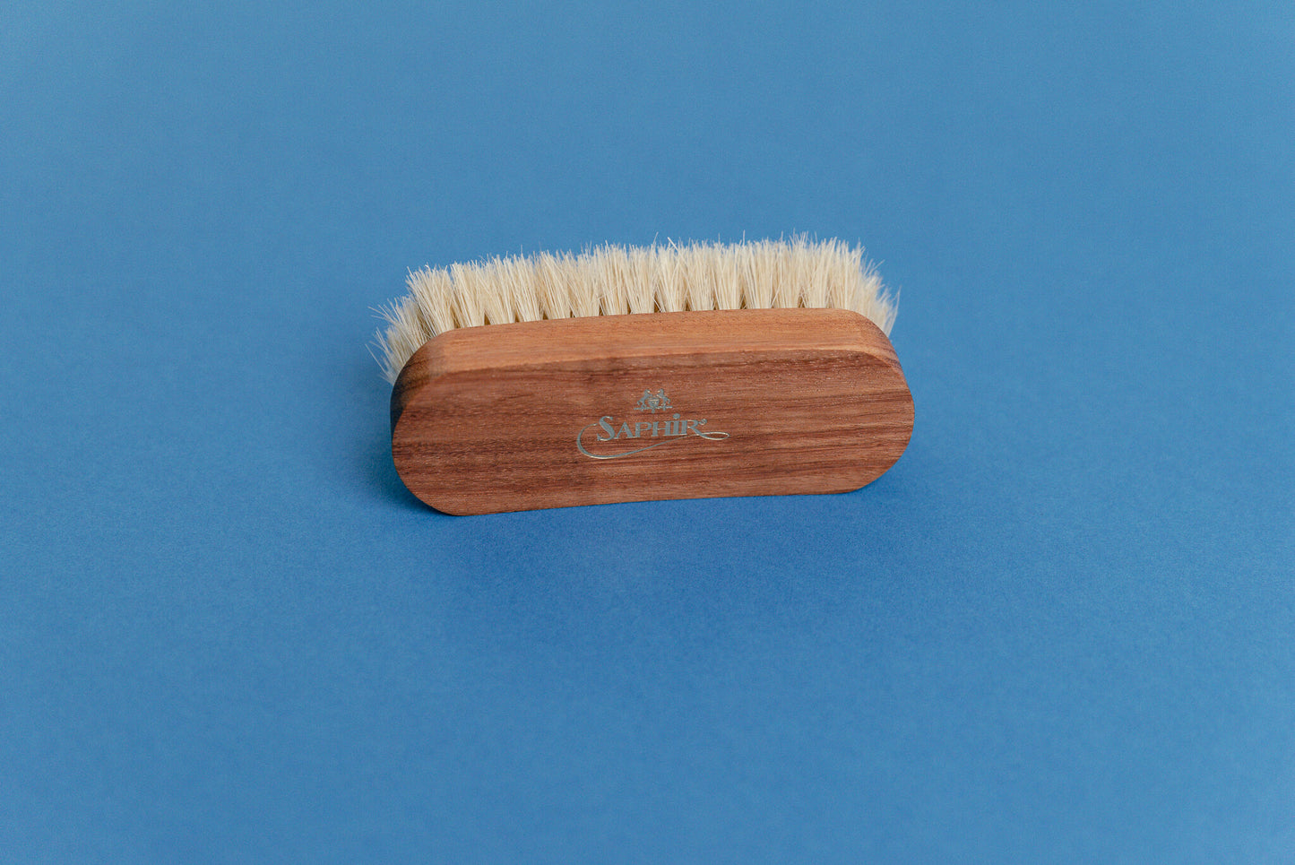 Saphir Medaille d'Or Mini Horse Hair Brush close up of wooden handle at an angle