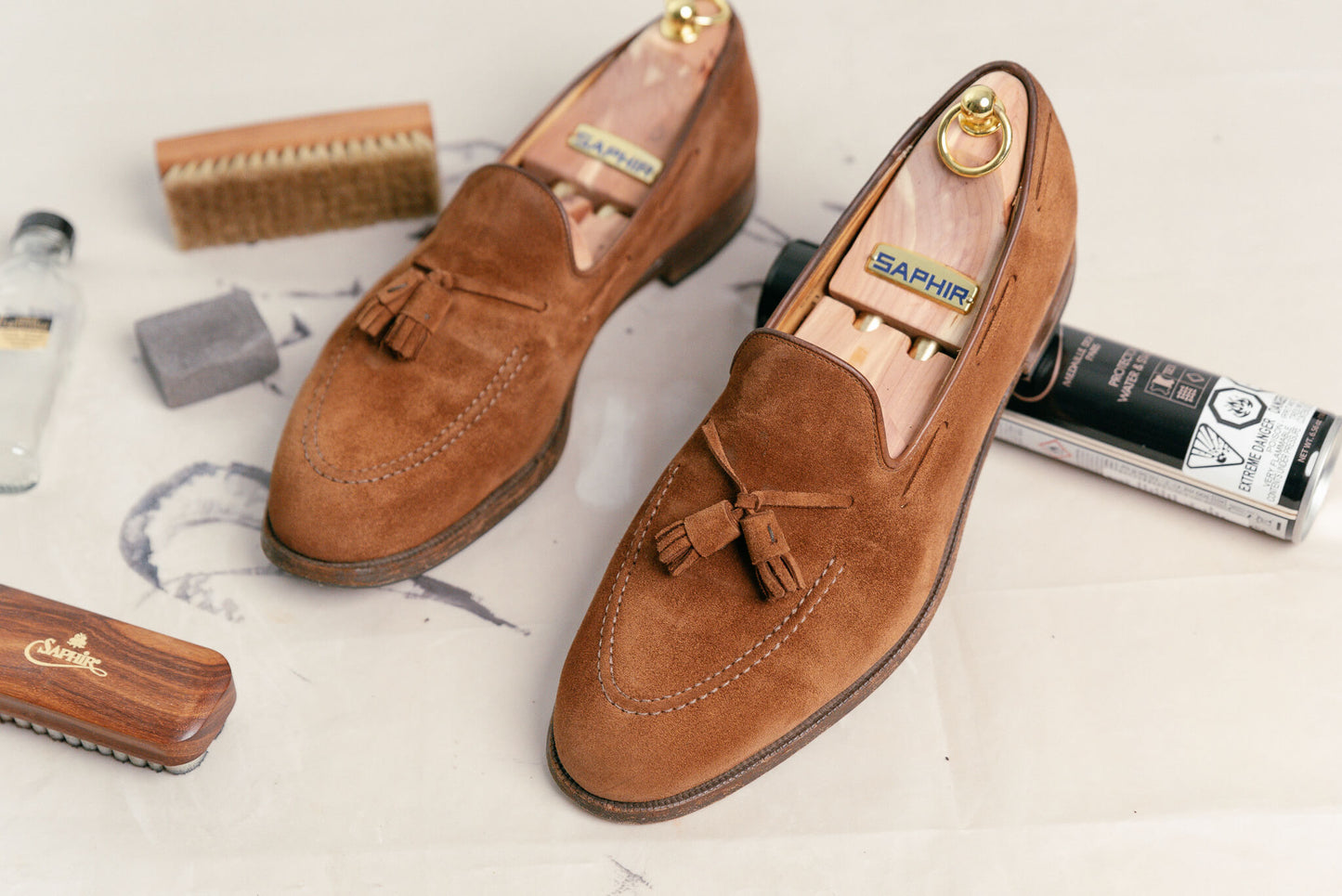 Saphir Cedar Shoe Trees displayed inside a pair of crockett & jones cavendish loafer in snuff suede after cleaning - Brillare