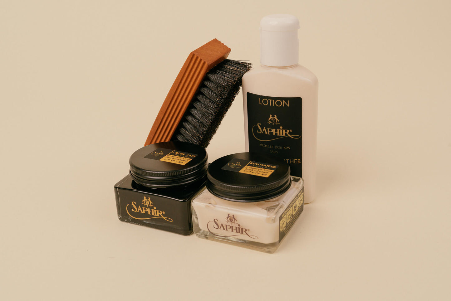 Brillaré Minimalist Shoe Care Kit photo. Contains Saphir Medaille d'or Horse hair polish brush, leather lotion, pommadier 1925 cream polish, and renovateur renovating cream polish
