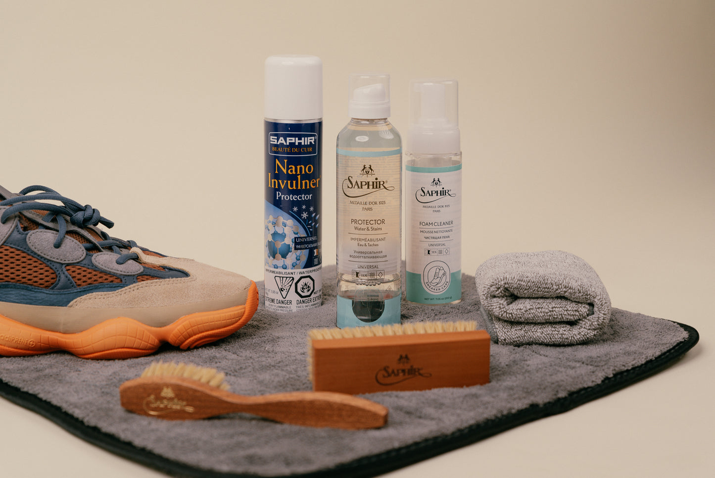 Brillaré Premium sneaker car kit. Feating Saphir Medaille d'or Horse hair spatula brush, horsehair shine brush, foam cleaner, & protectant spray. Saphir BDC Nano Invulner spray, jumbo brillare cleaning mat and brillare deluxe microfibre cloth with yeezy 500 enflame